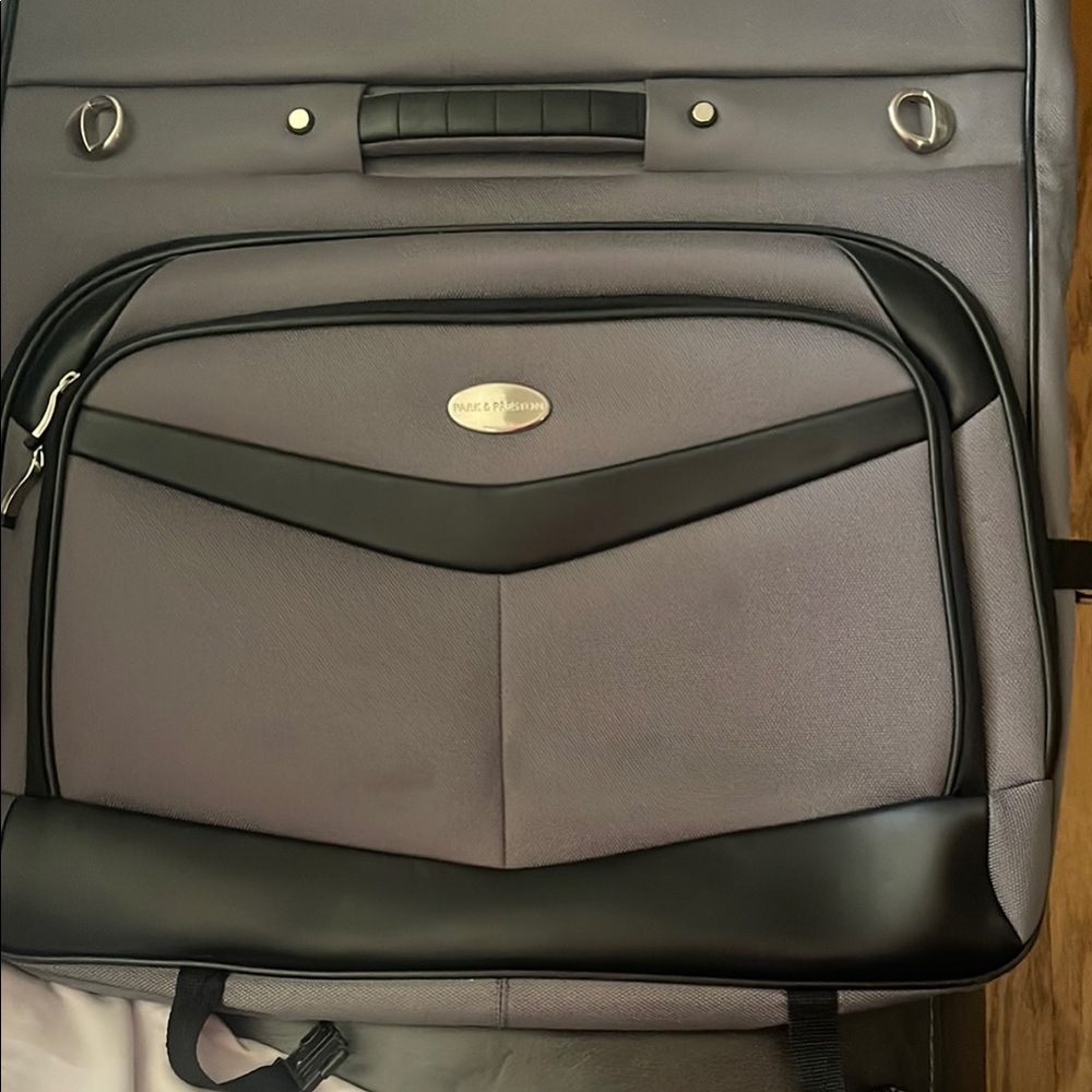 Black and Gray Travel Bags with Metal Accents